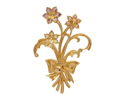 Lot 51 - A 9k CZ set ribbon and foliate spray design brooch.