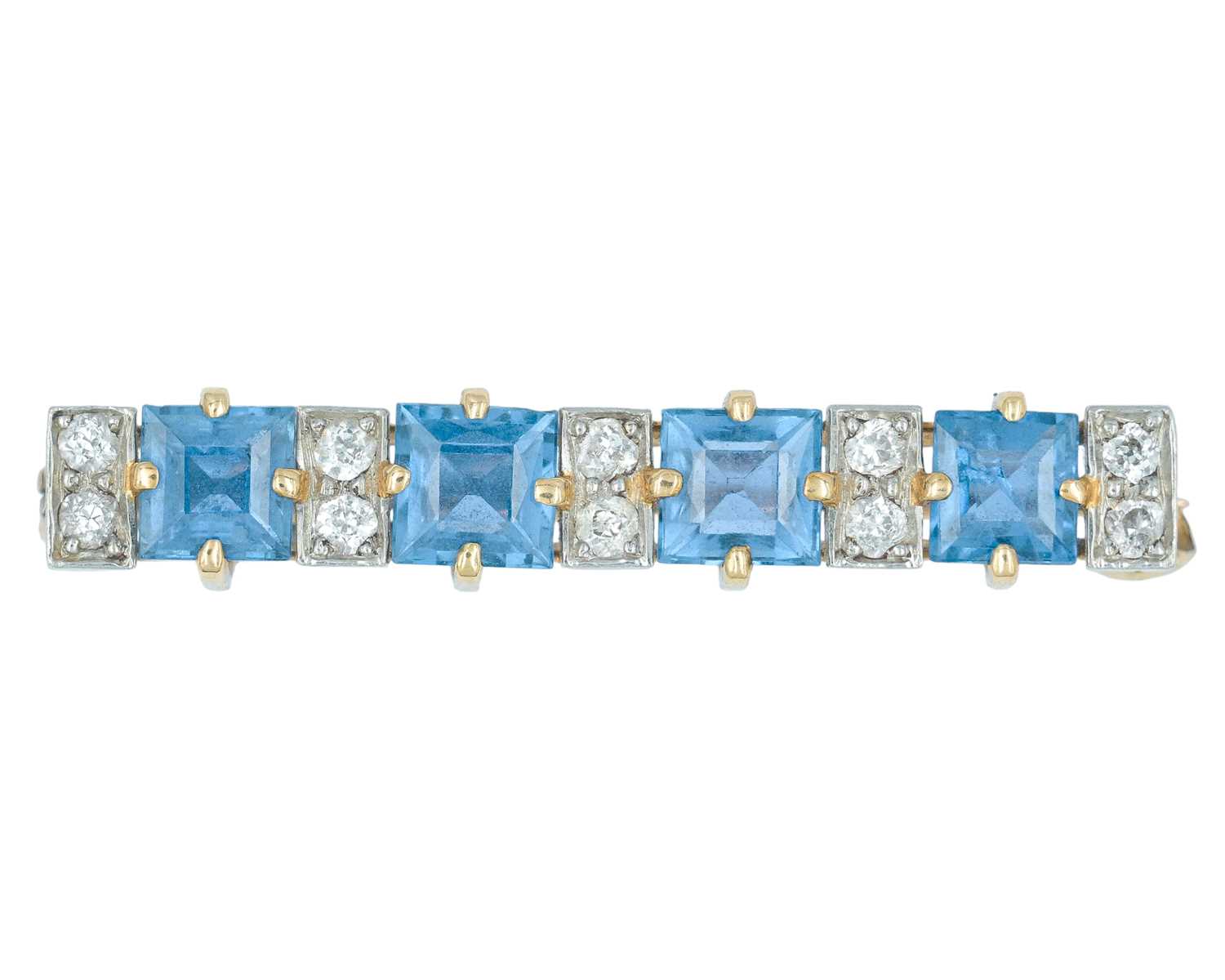 Lot 74 - An Art Deco 14k brooch set with four square, step-cut sapphires and old mine-cut diamonds.
