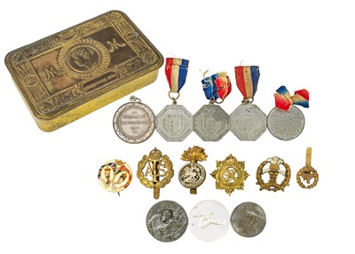 Lot 286 - Queen Mary Gift Tin containing various cap badges and medallions.