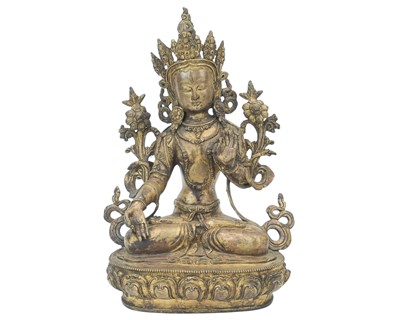 Lot 447 - A Sino-Tibetan gilded bronze figure of Green Tara.