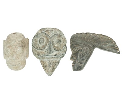 Lot 446 - Three Chinese or Asian carved jade masks.