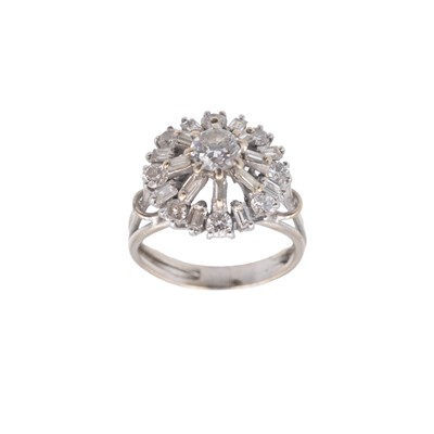 Lot 160 - An 18k white gold (tested) diamond set cluster ring.