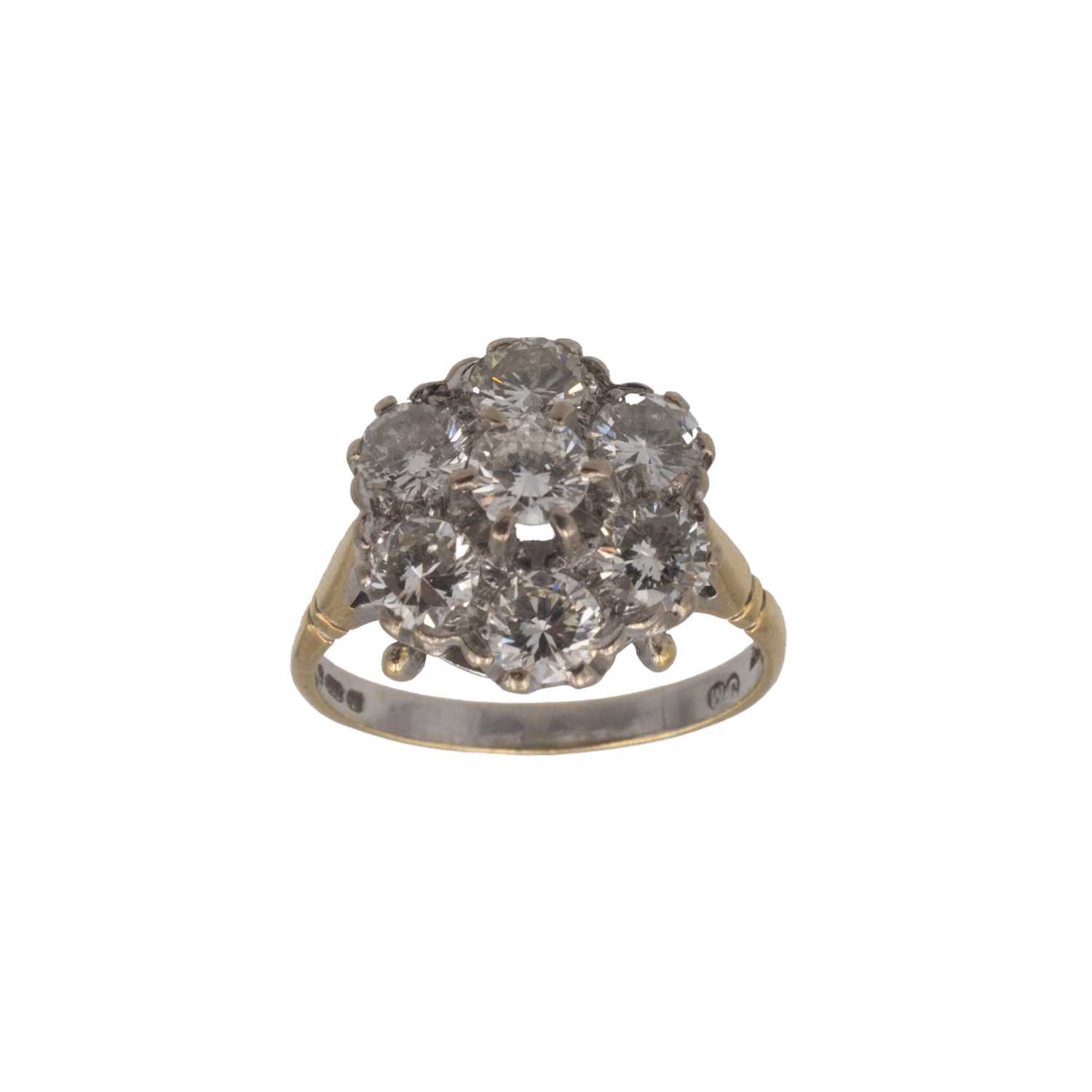 Lot 163 - An attractive and vibrant diamond set 18k daisy cluster ring.