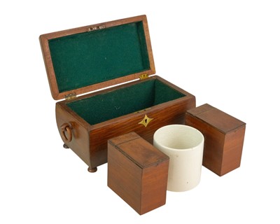 Lot 42 - A 19th century partridge wood tea caddy of sarcophagus form.