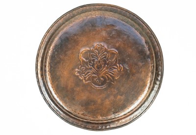 Lot 47 - An Arts and Crafts Hugh Wallis copper tray of circular form.