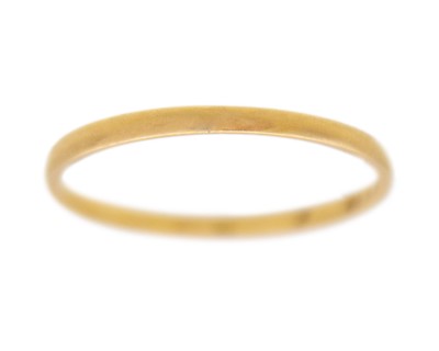 Lot 125 - A 22k hallmarked gold thin band ring.