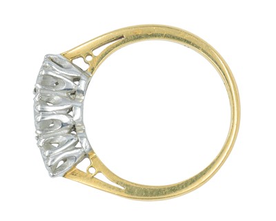 Lot 79 - An 18k gold three-stone diamond ring.