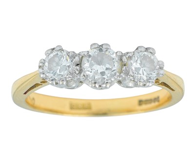 Lot 79 - An 18k gold three-stone diamond ring.