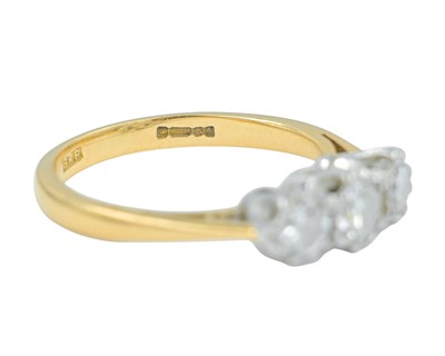Lot 79 - An 18k gold three-stone diamond ring.