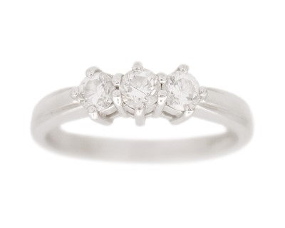 Lot 127 - A 18k white gold three-stone diamond ring.