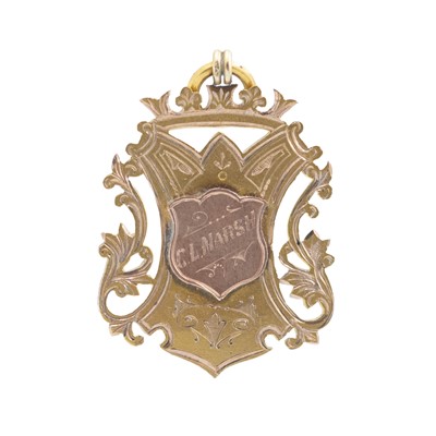 Lot 140 - A Victorian 9k yellow and rose gold shield fob.