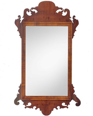 Lot 816 - A George III style walnut fretwork mirror.