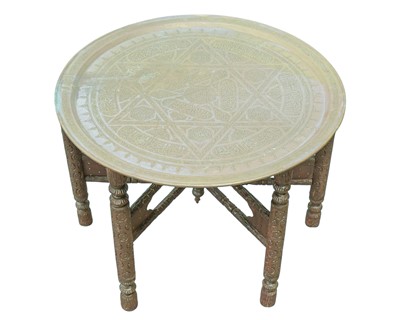 Lot 900 - A Middle Eastern brass tray table.