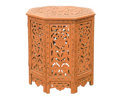 Lot 909 - An Indian carved teak table.
