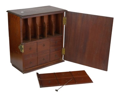Lot 58 - A late George III mahogany apothecary cabinet.