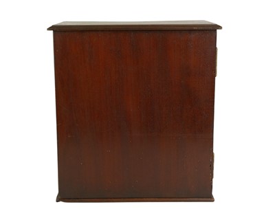 Lot 58 - A late George III mahogany apothecary cabinet.