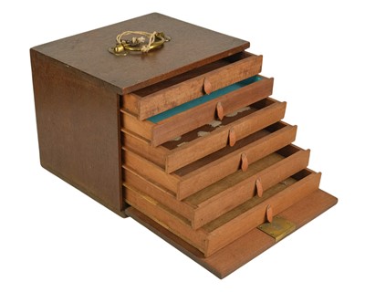 Lot 120 - An oak collector's cabinet.