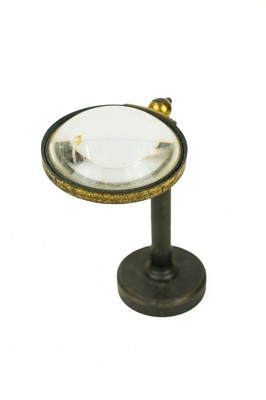 Lot 40 - A brass and lacquered adjustable bulls eye lens.
