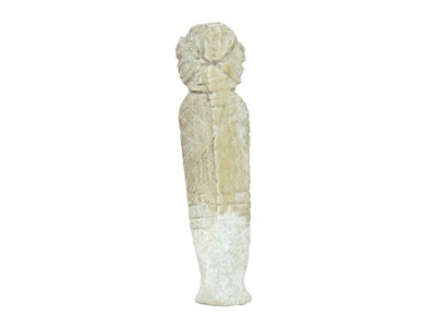 Lot 106 - A small carved stone figure of a deity.