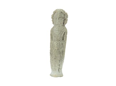 Lot 106 - A small carved stone figure of a deity.