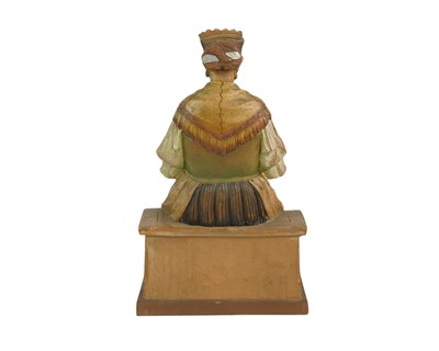 Lot 72 - A carved and painted pine figure of a lady knitting.