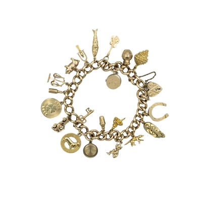 Lot 134 - A 15k gold charm bracelet, applied with mostly 9k charms.