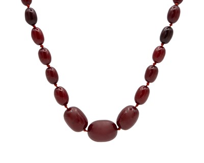 Lot 85 - A bakelite cherry amber style graduated oval bead necklace.