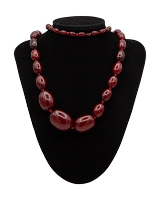 Lot 85 - A bakelite cherry amber style graduated oval bead necklace.