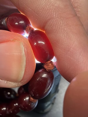 Lot 85 - A bakelite cherry amber style graduated oval bead necklace.