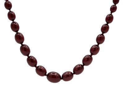 Lot 130 - A bakelite cherry amber style graduated oval bead necklace.