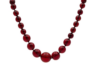 Lot 167 - A cherry amber style graduated circular bead necklace.
