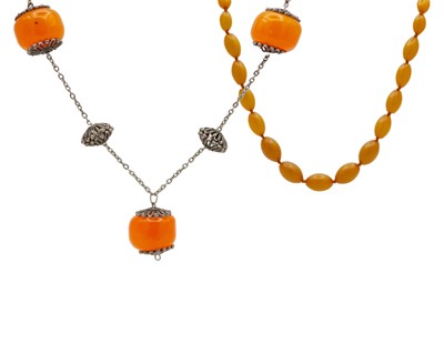 Lot 195 - An African copal amber and white metal chain and bead necklace.