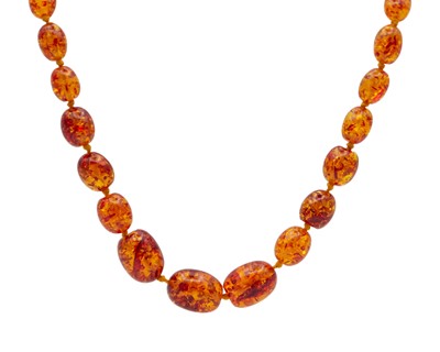 Lot 199 - A reconstituted amber oval graduated bead necklace.