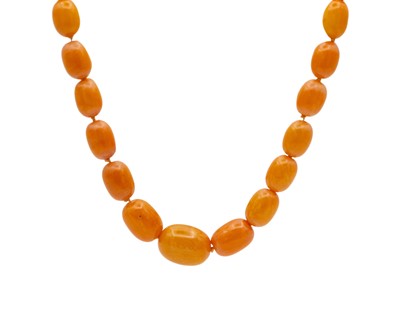 Lot 124 - A butterscotch amber graduated oval bead necklace.