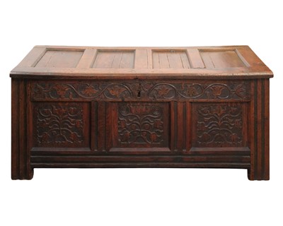 Lot 745 - An 18th century carved oak coffer.