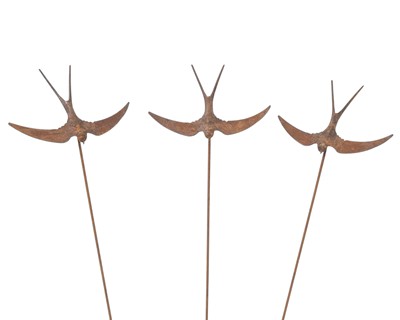 Lot 829 - A flight of three wrought iron garden swallows.