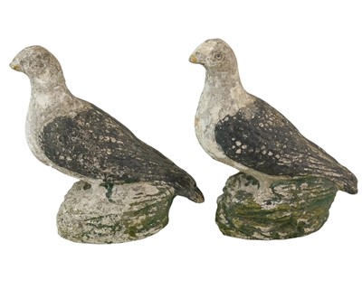 Lot 826 - A pair of reconstituted stone figures of pigeons.