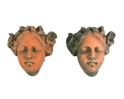 Lot 833 - A pair of Art Nouveau style terracotta wall masks.
