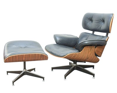 Lot 637 - A swivel lounge chair and ottoman, after a design by Charles & Ray Eames.