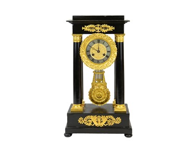 Lot 756 - A French ebonised and ormolu mounted portico clock.