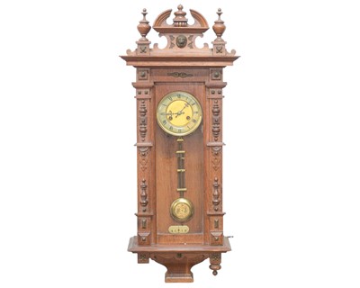 Lot 777 - A Vienna type glazed oak wall clock.