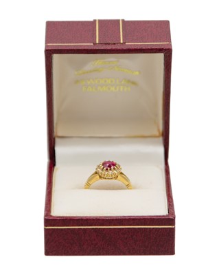 Lot 205 - A good early 20th-century 1.00ct ruby and diamond cluster ring, set in 18k gold.