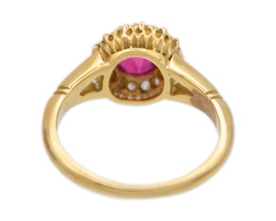 Lot 205 - A good early 20th-century 1.00ct ruby and diamond cluster ring, set in 18k gold.