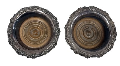 Lot 8 - Two Victorian silver-plated wine coasters,...