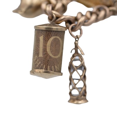 Lot 158 - A good 9k charm bracelet applied with 10 gold charms and a turquoise set padlock clasp.