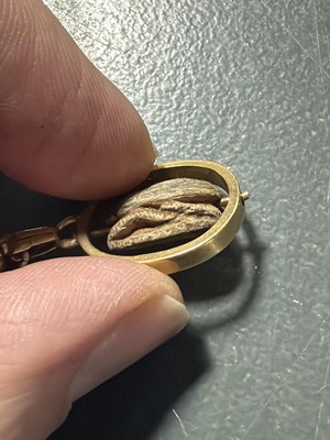 Lot 158 - A good 9k charm bracelet applied with 10 gold charms and a turquoise set padlock clasp.