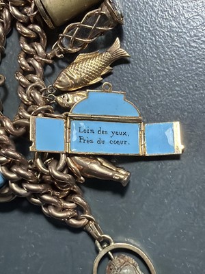 Lot 158 - A good 9k charm bracelet applied with 10 gold charms and a turquoise set padlock clasp.