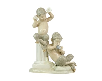 Lot 535 - A Lladro faun figure group.