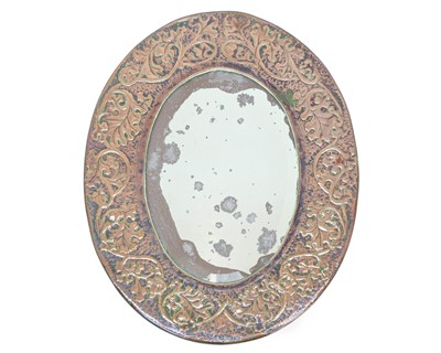 Lot 736 - An oval copper framed wall mirror.