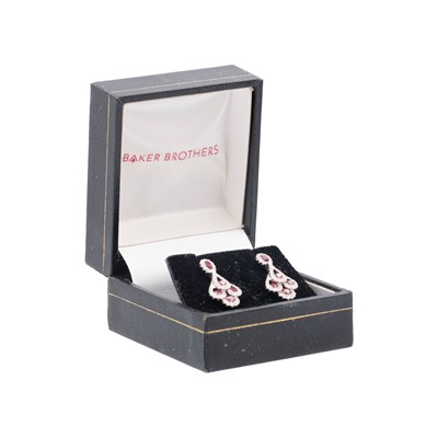 Lot 189 - An attractive pair of 18k white gold ruby and diamond set pendant stud earrings.